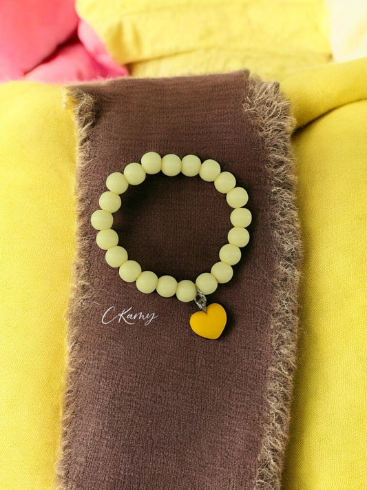 Bracelet enfant accroche coeur jaune clair