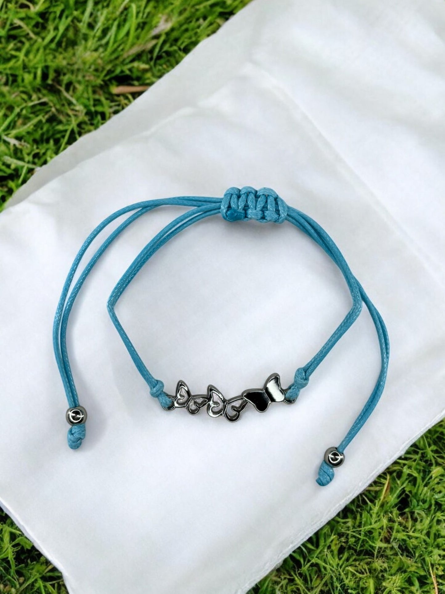 Bracelet enfant cordon 3 papillons bleu