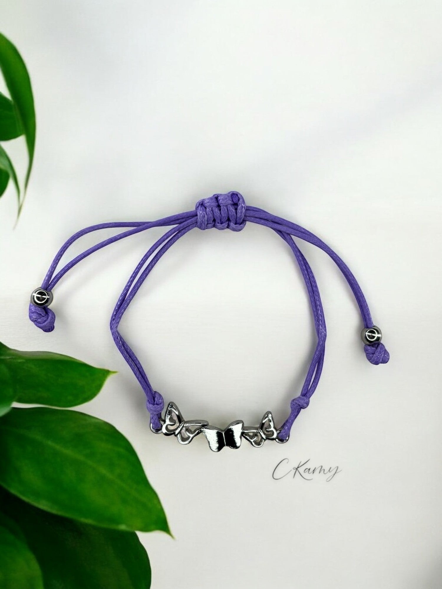 Bracelet enfant cordon 3 papillons violet