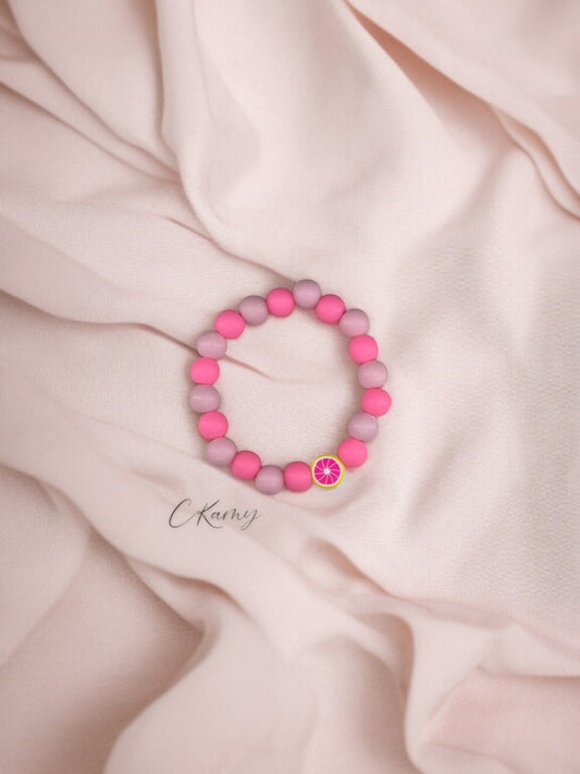 Bracelet enfant fruits pamplemousse perles rose clair rose foncé