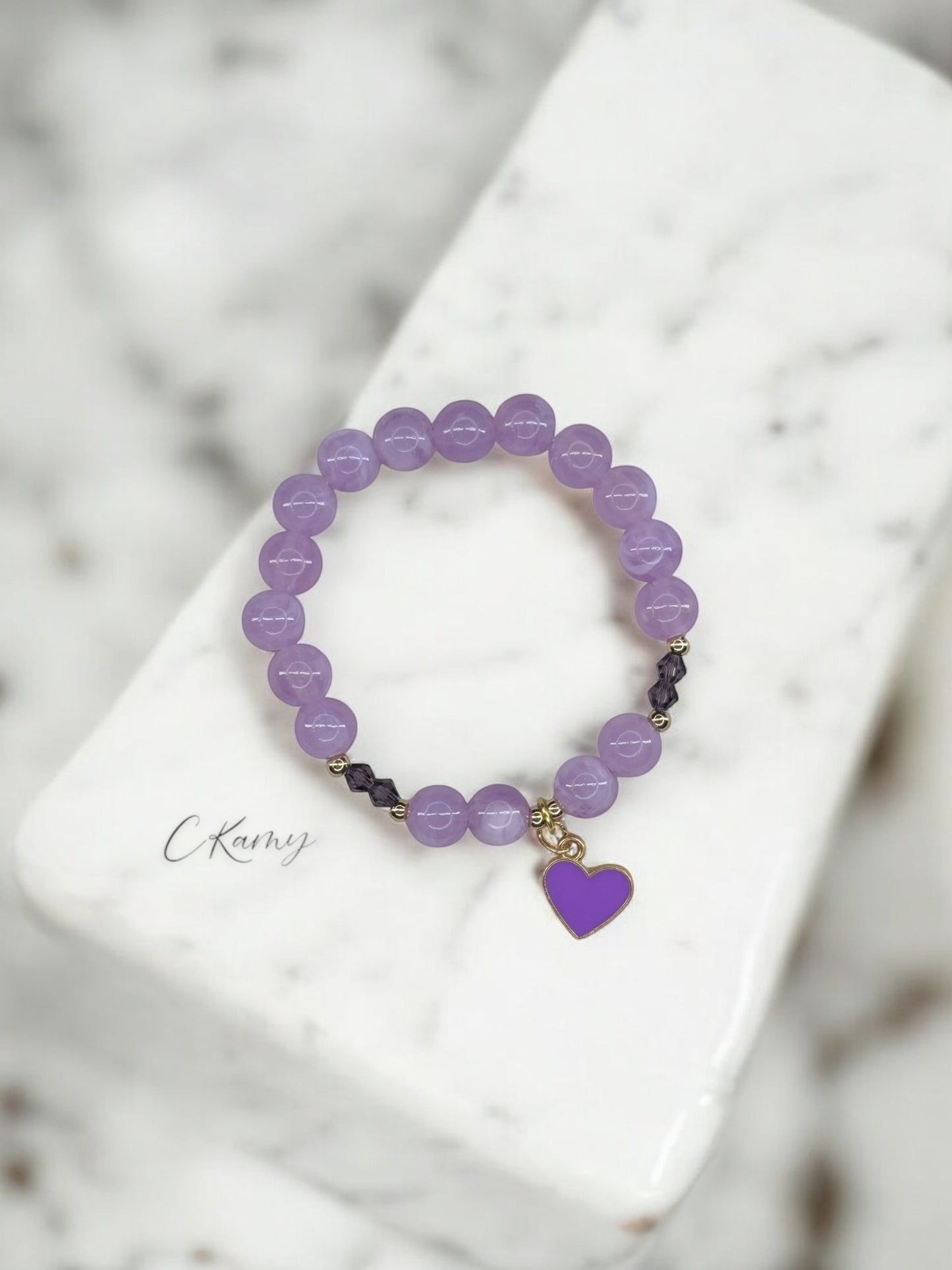 Bracelet enfant toupies & coeur violet