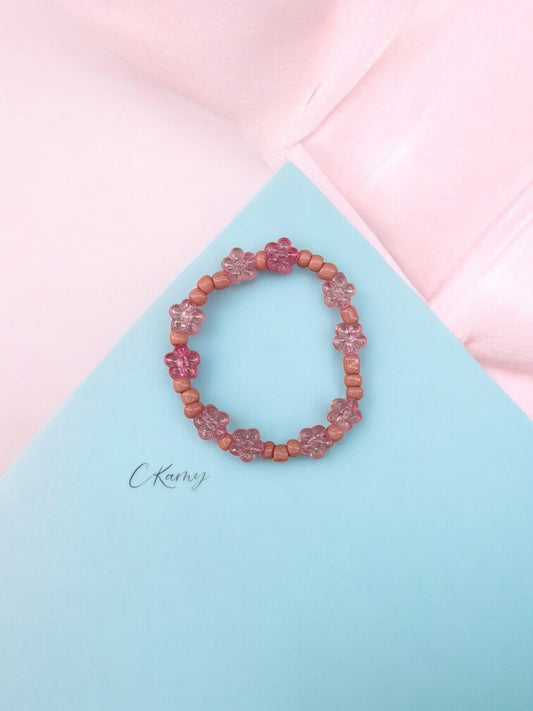 Bracelet enfant tour fleurs rose clair