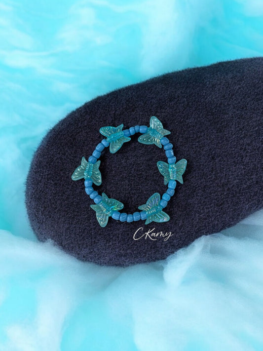 Bracelet enfant tour papillon bleu ciel