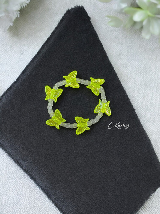 Bracelet enfant tour papillon jaune fluo