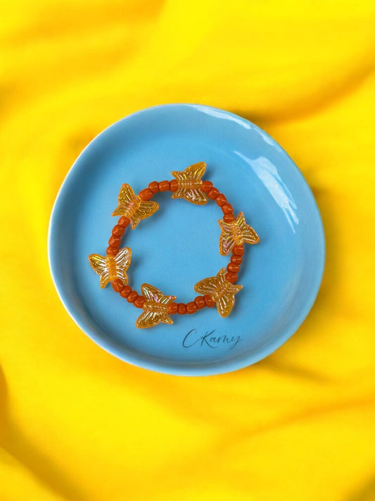 Bracelet enfant tour papillon orange