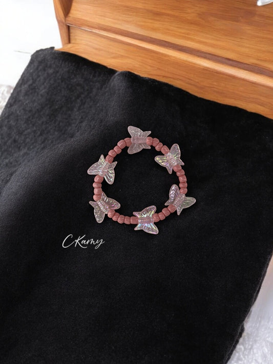 Bracelet enfant tour papillon rose clair