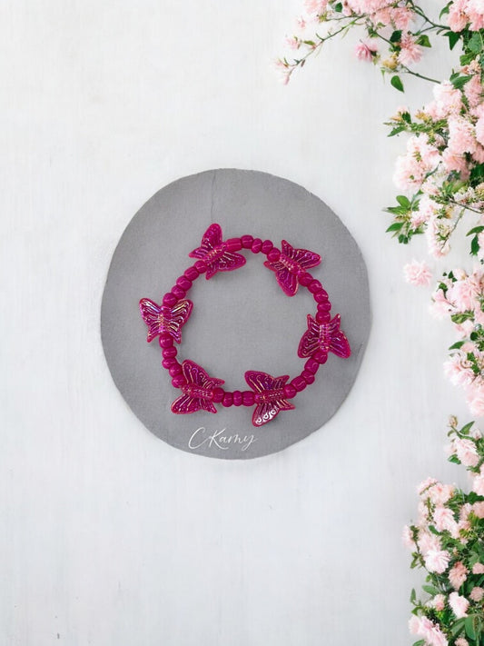 Bracelet enfant tour papillon rose framboise