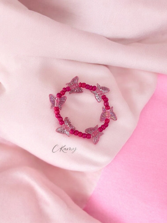 Bracelet enfant tour papillon rose fuchsia
