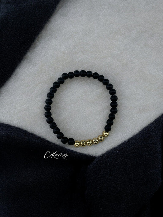 Bracelet homme milieu doré perles noir
