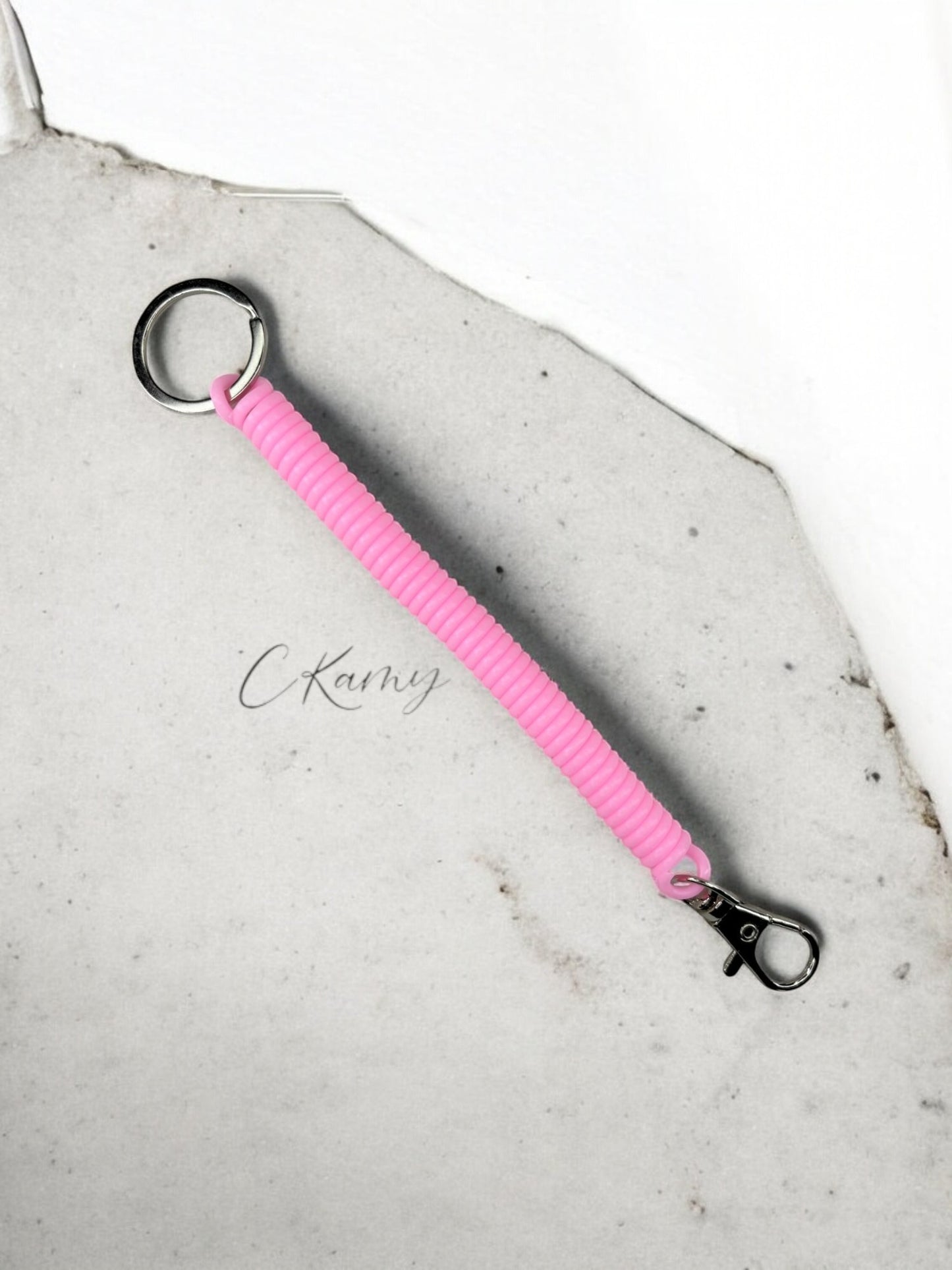 Porte clé câble spirale rose clair