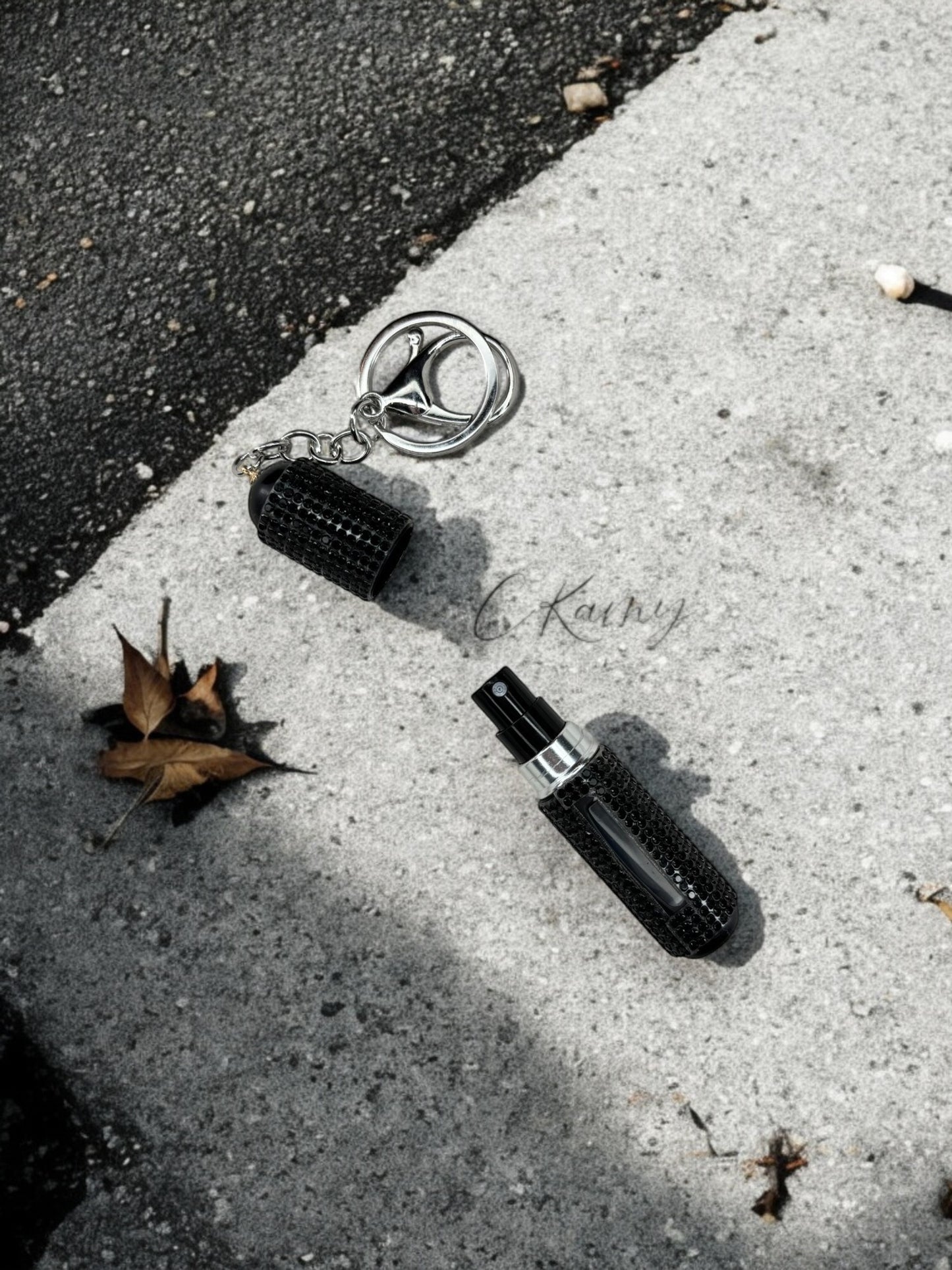 Porte clé contenant pour parfum noir