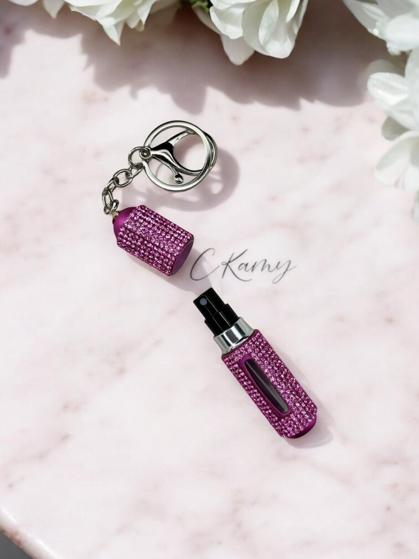 Porte clé contenant pour parfum rose