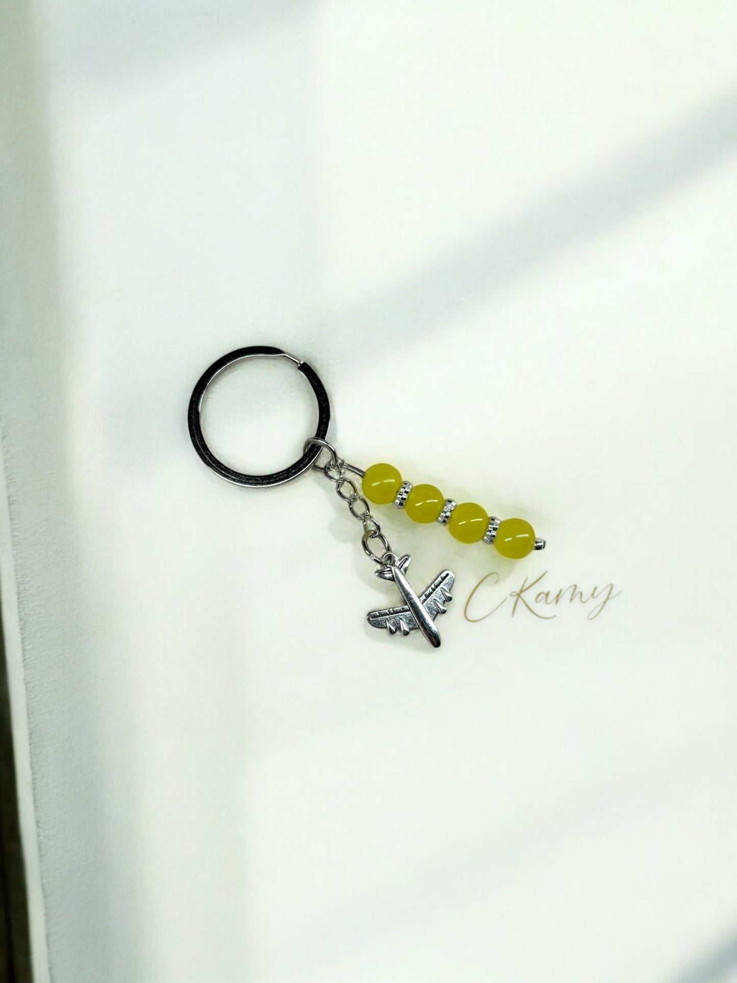 Porte clé personnalisé avion jaune anneau rond