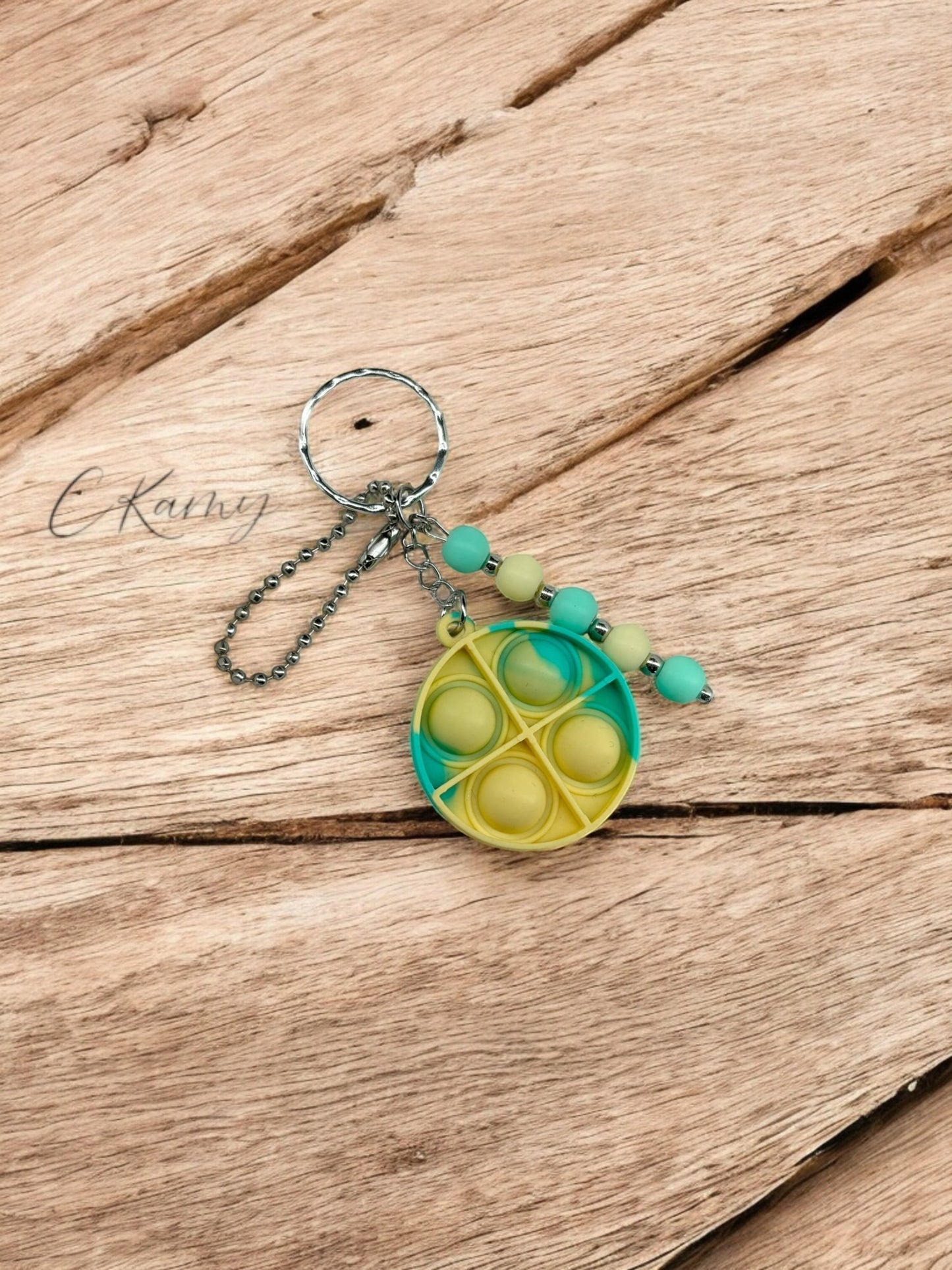 Porte clé personnalisé pop it rond jaune vert