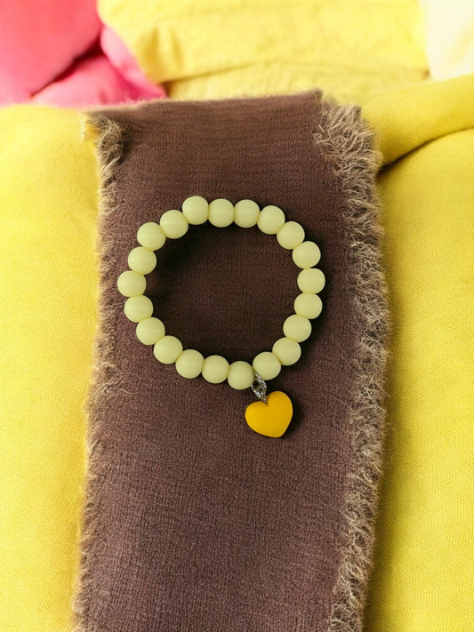 Bracelet enfant accroche coeur jaune clair