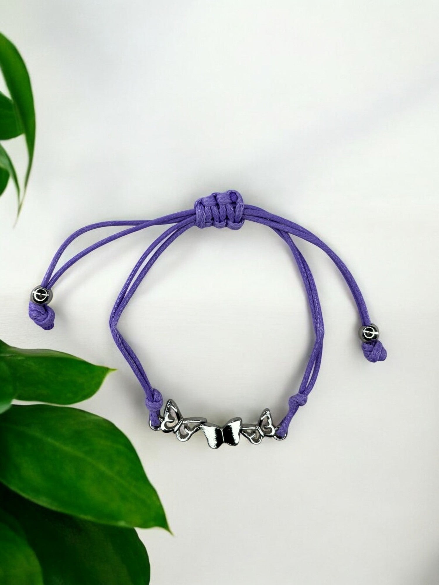 Bracelet enfant cordon 3 papillons violet