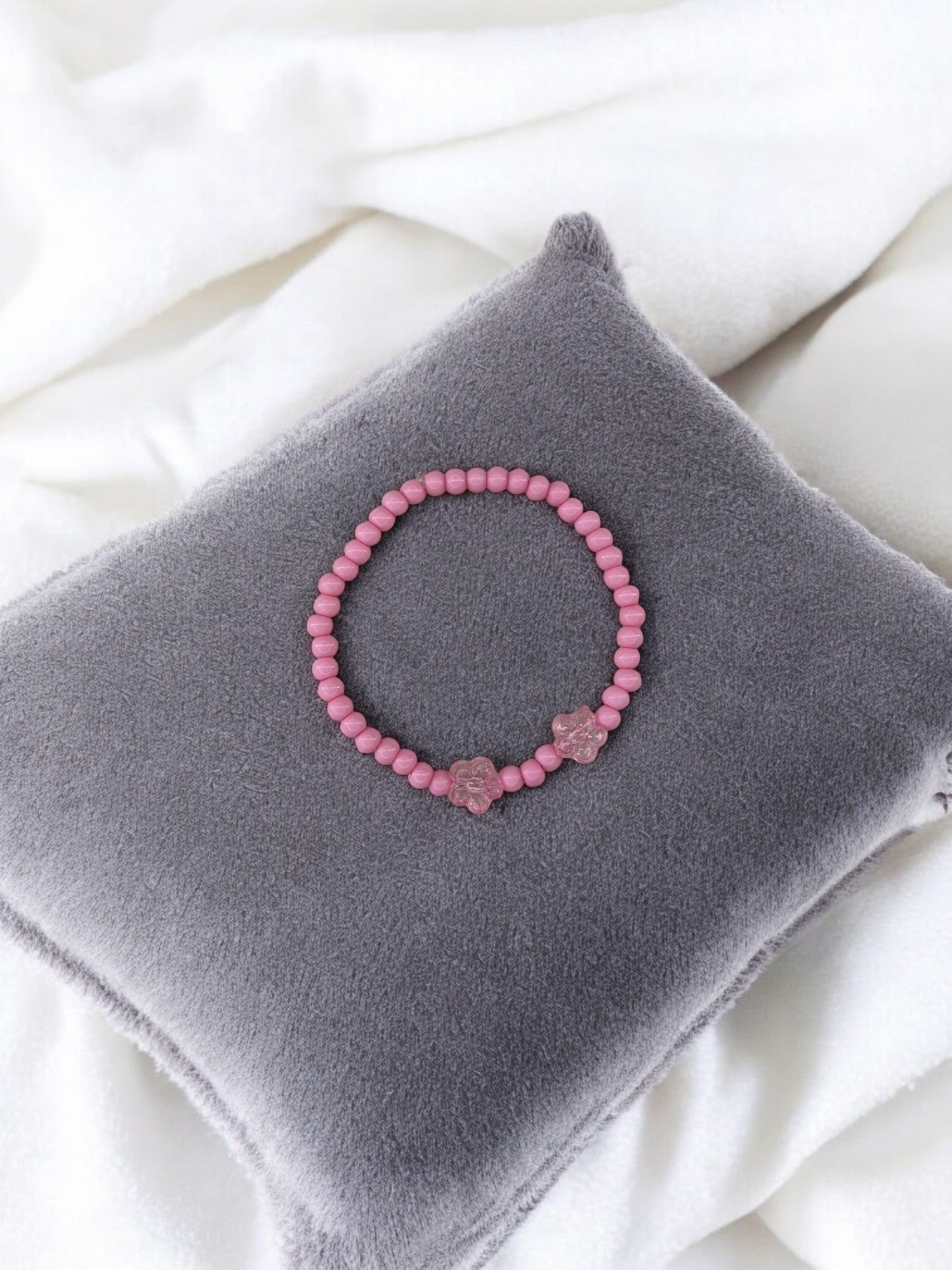 Bracelet enfant deux fleurs rose clair