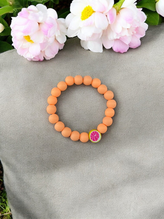Bracelet enfant perles orange pamplemousse