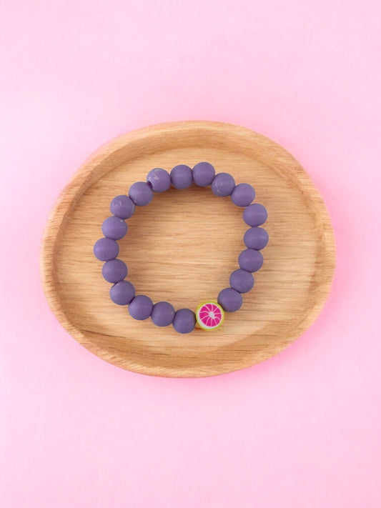 Bracelet enfant perles violet pamplemousse