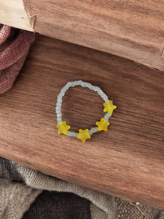 Bracelet enfant petites étoiles jaune transparent