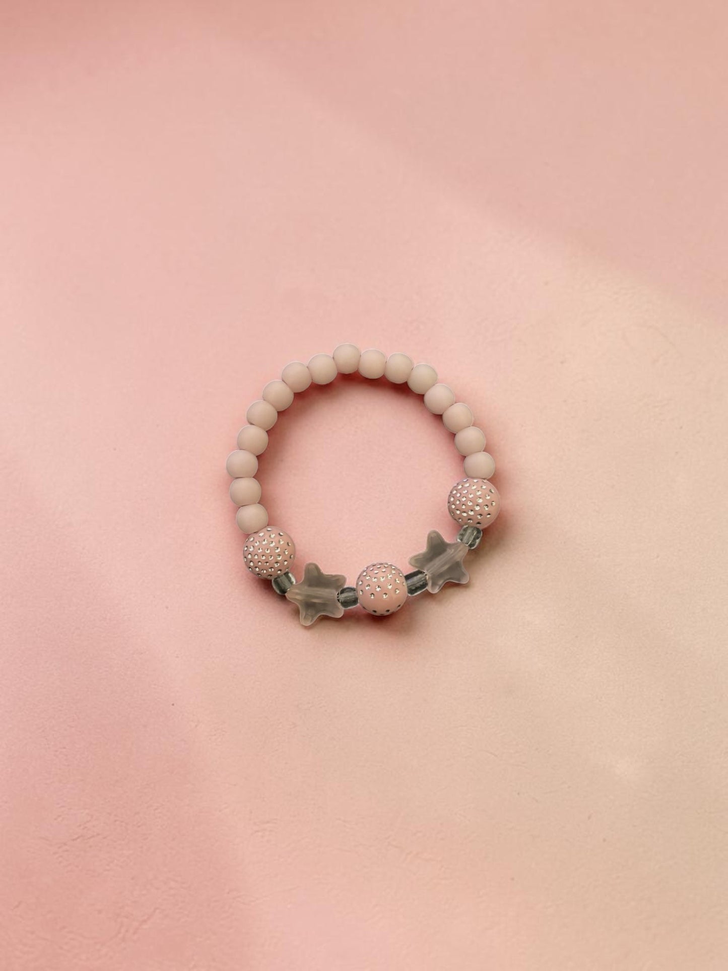 Bracelet enfant petites étoiles rose clair brillant