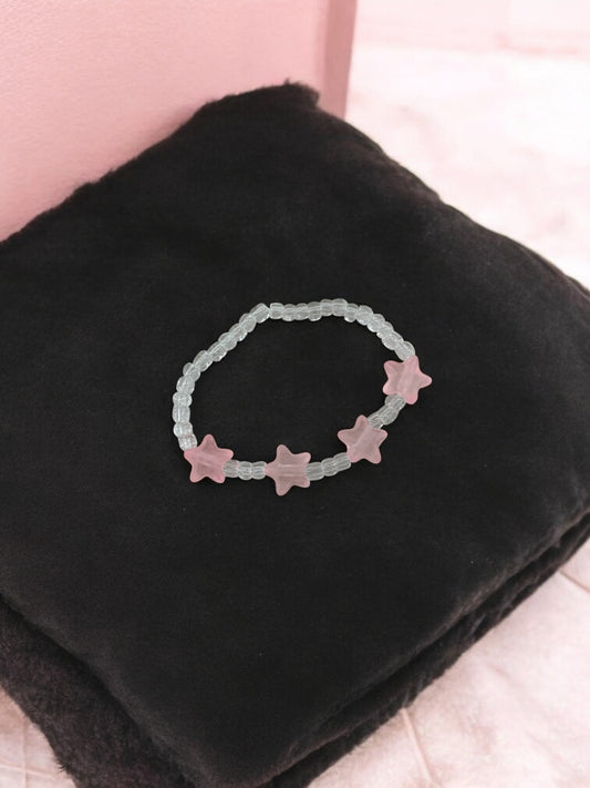 Bracelet enfant petites étoiles rose clair transparent