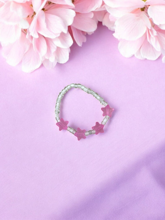Bracelet enfant petites étoiles rose foncé blanc transparent
