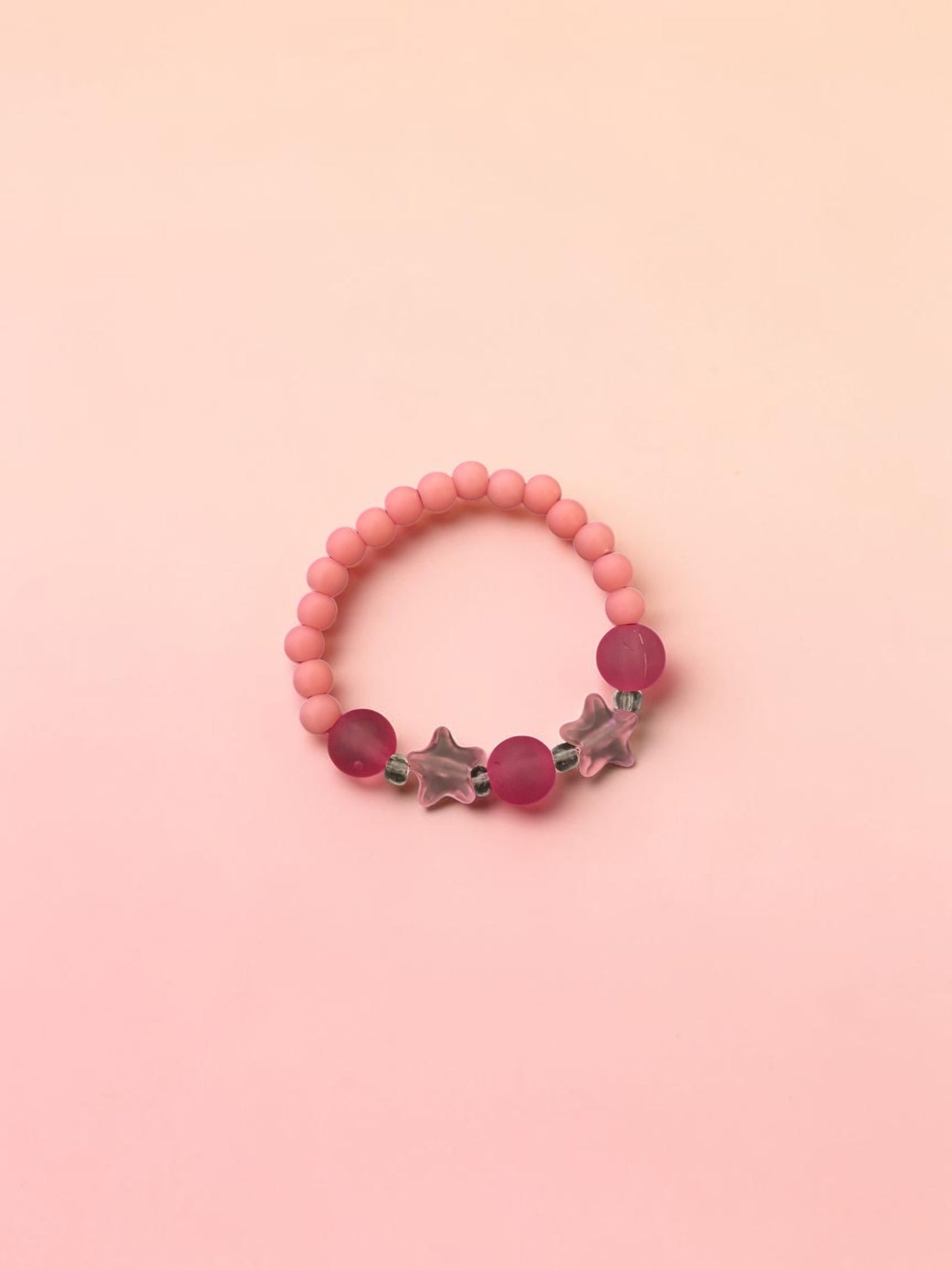 Bracelet enfant petites étoiles rose foncé mat