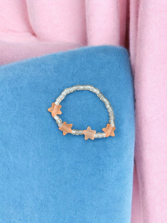 Bracelet enfant petites étoiles rose saumon blanc transparent