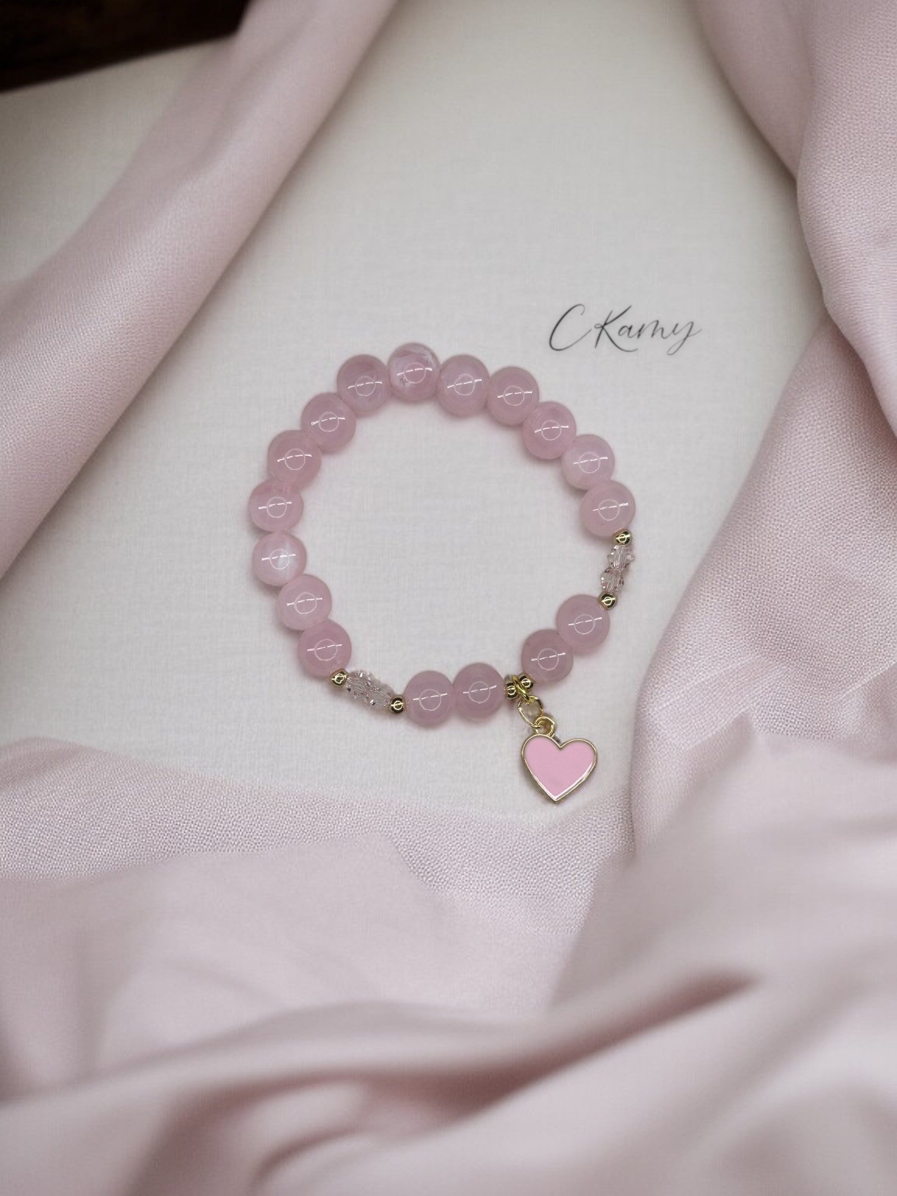 Bracelet enfant toupies & coeur rose