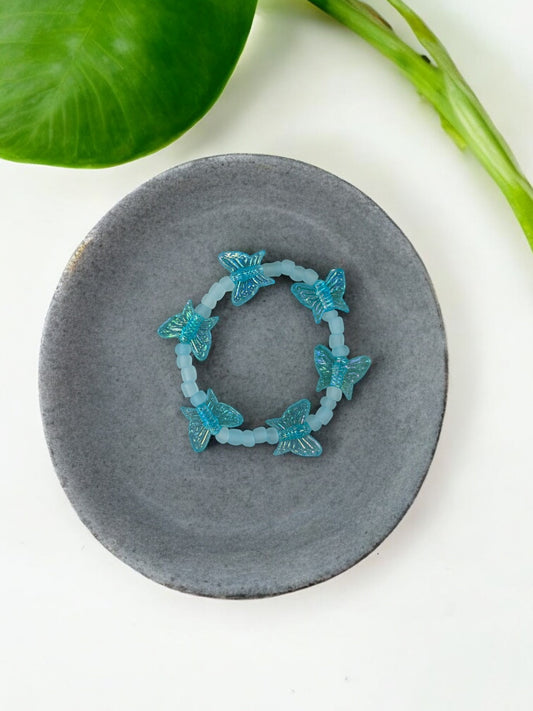 Bracelet enfant tour papillon bleu clair