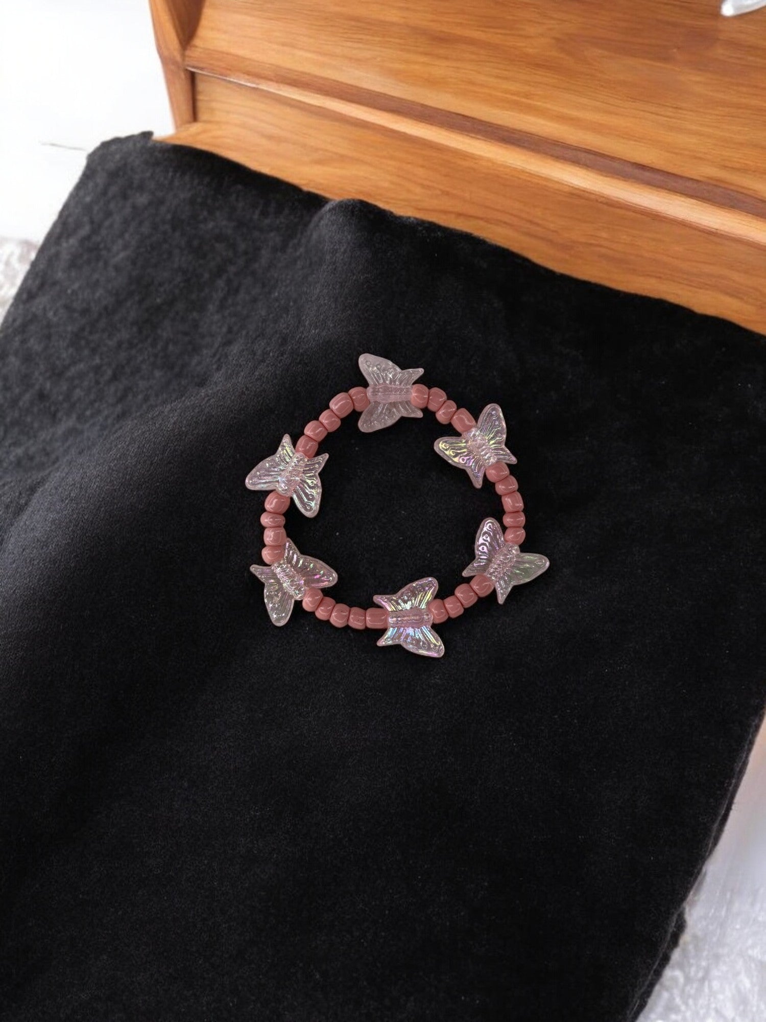Bracelet enfant tour papillon rose clair