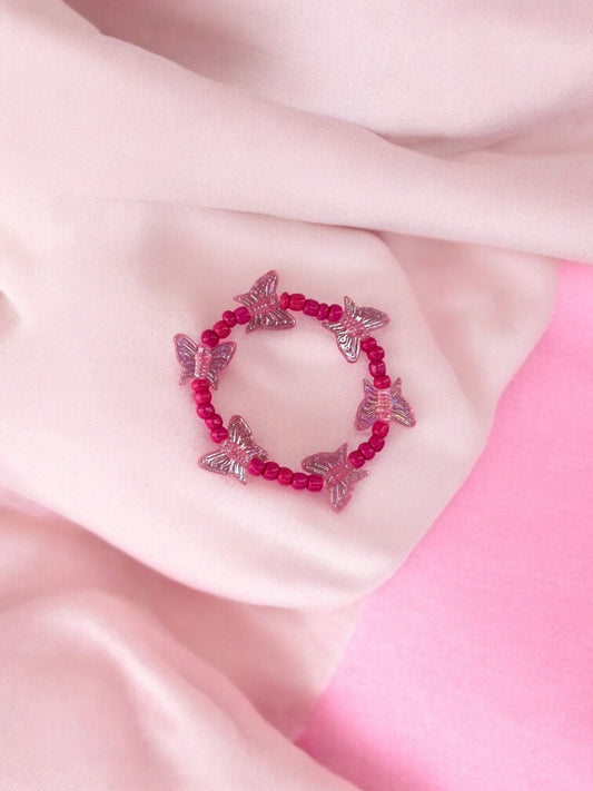 Bracelet enfant tour papillon rose fuchsia