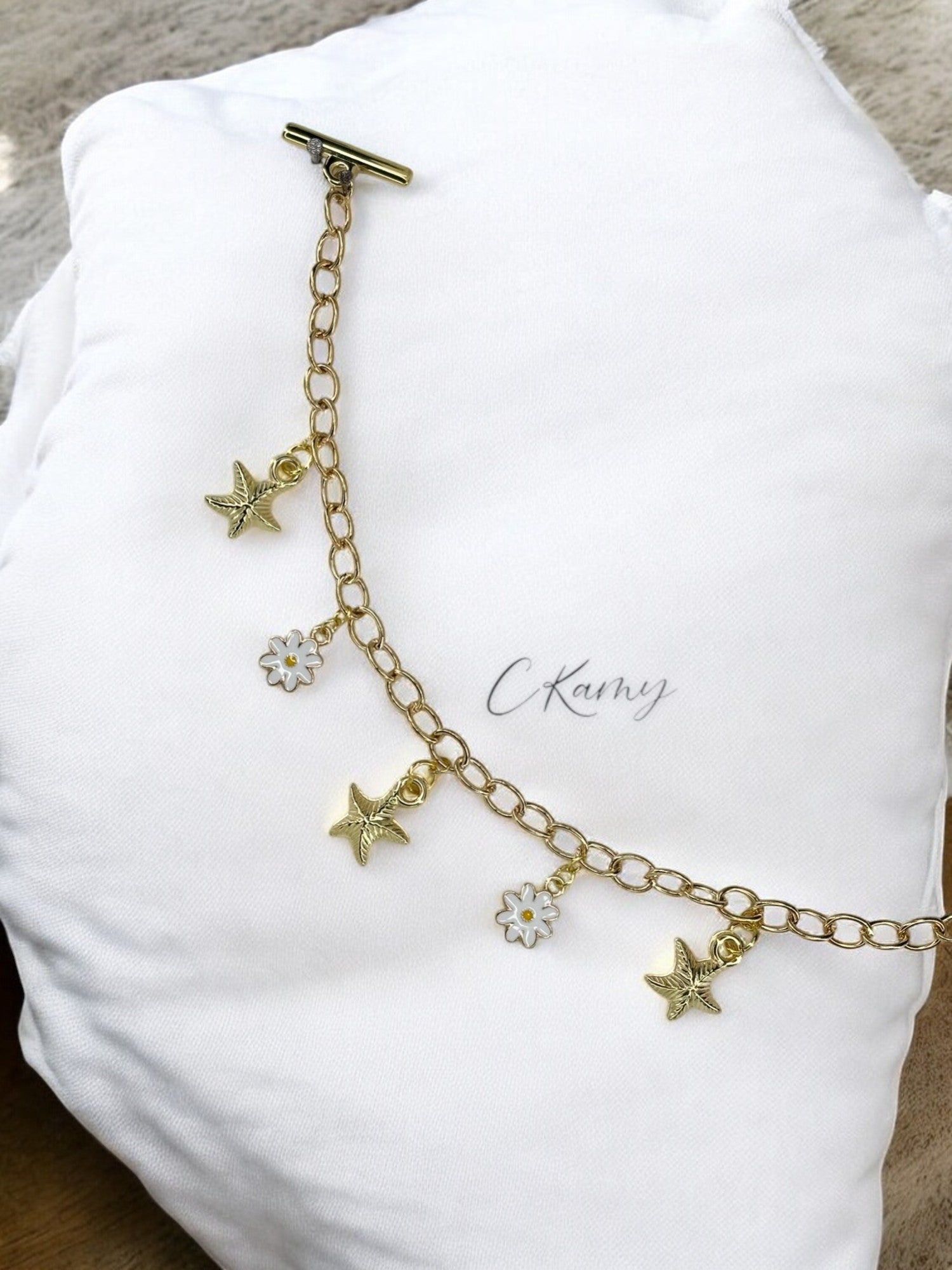 Bracelet femme chaîne étoile de mer et marguerite