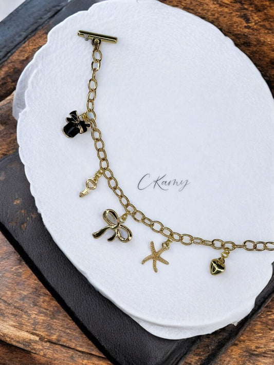 Bracelet femme chaîne étoile de mer parfum noir