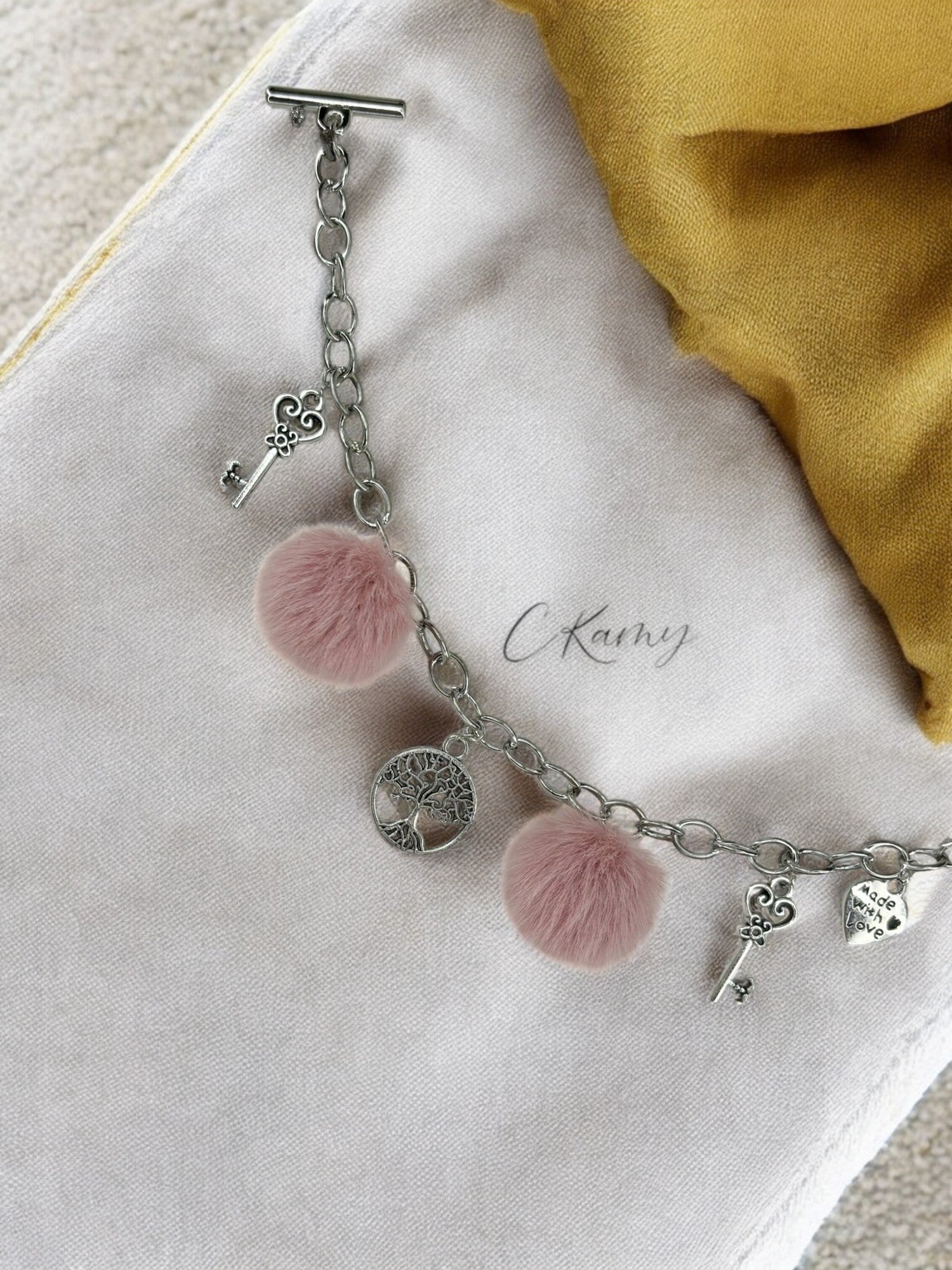 Bracelet femme chaîne moumoute rose pastel