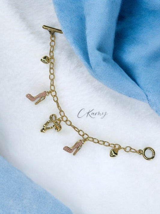 Bracelet femme, Chaine en acier inoxydable dorée. Modèle : Talon Strassé Rose.