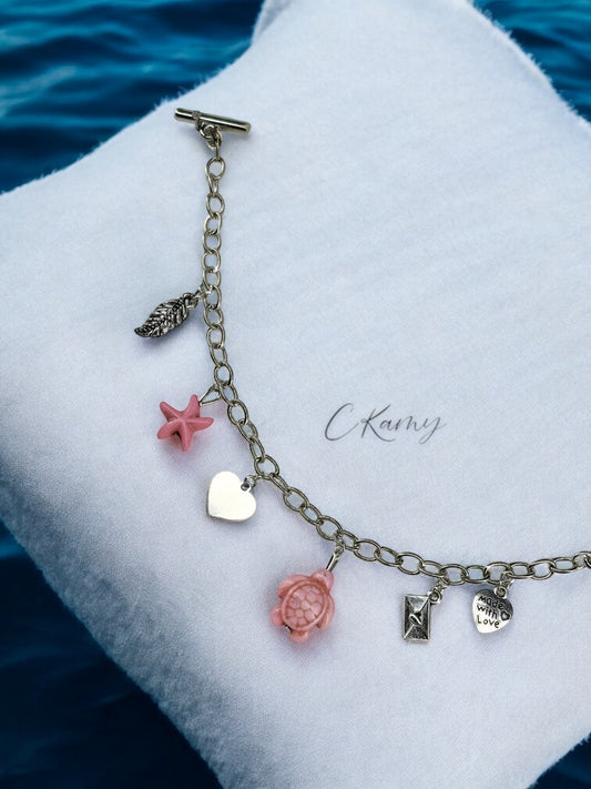 Bracelet femme chaîne tortue étoile de mer rose et feuille