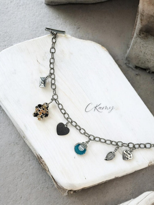 Bracelet femme chaîne tortue noir noix de saint jacques bleu