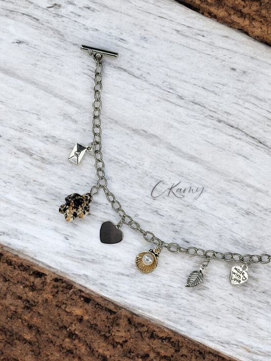 Bracelet femme chaîne tortue noir noix de saint jacques doré