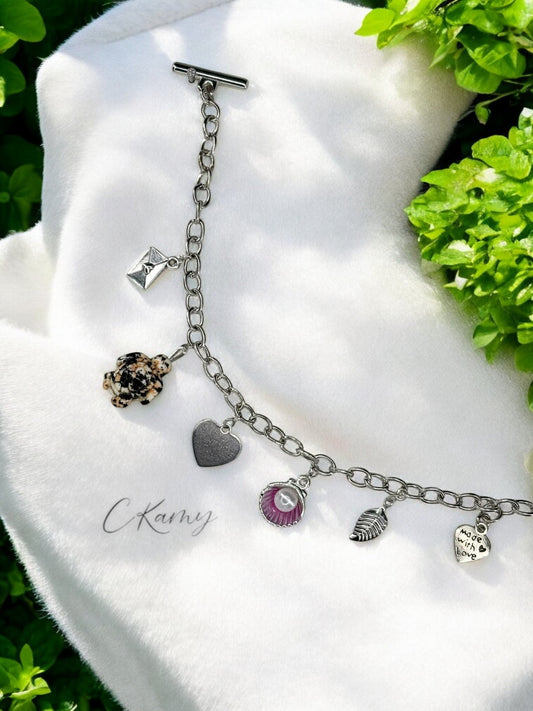 Bracelet femme chaîne tortue noir noix de saint jacques rose