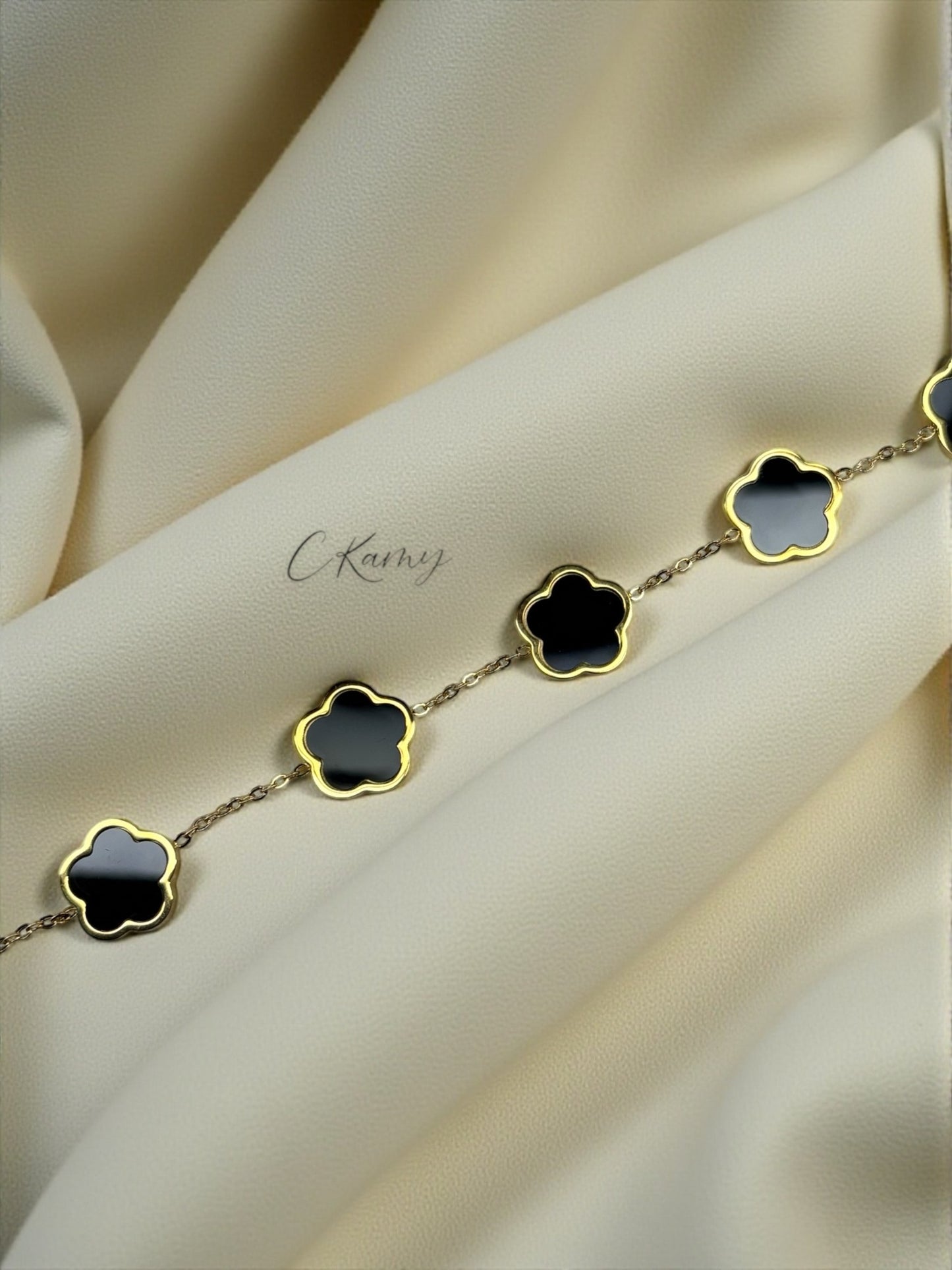 Bracelet femme chaînette doré trèfles noir