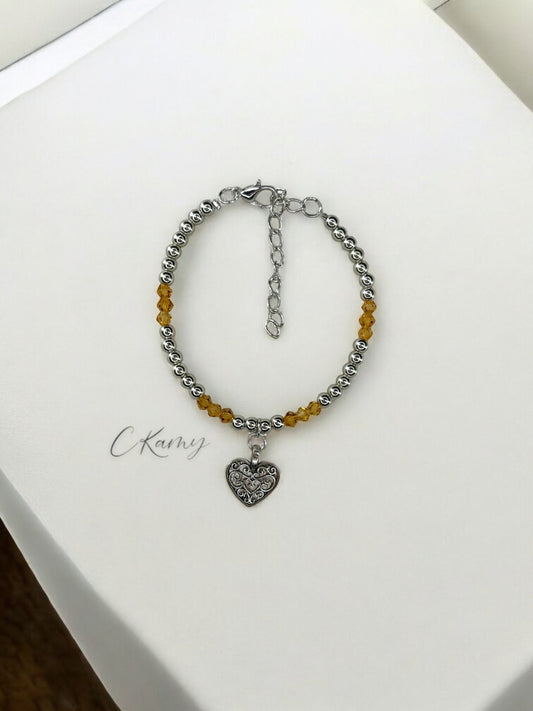Bracelet femme coeur ancien perles toupies orange clair