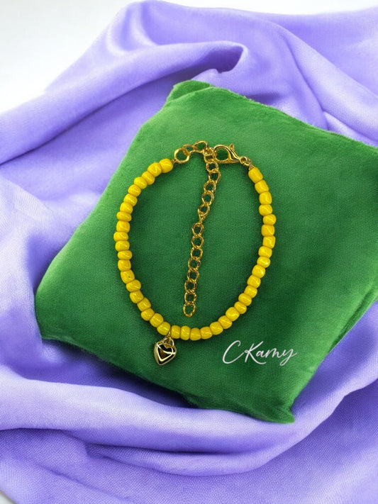 Bracelet femme coeur bombé rocaille jaune foncé