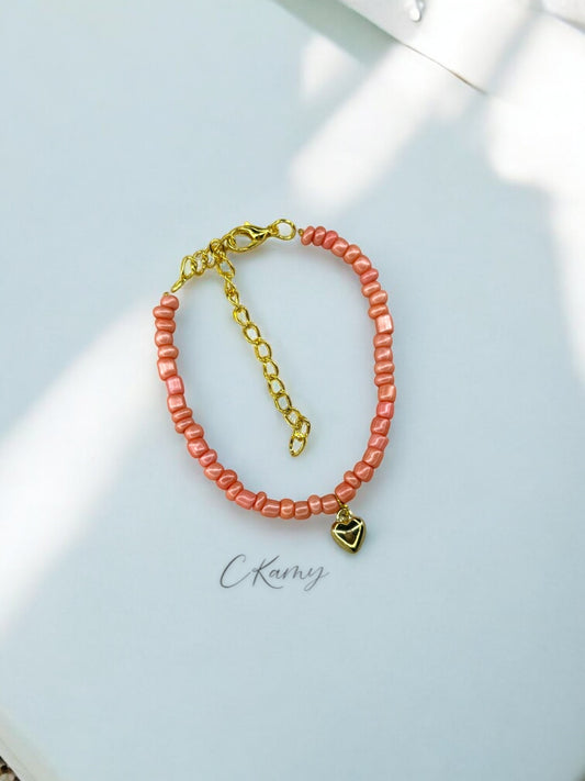 Bracelet femme coeur bombé rocaille rose corail