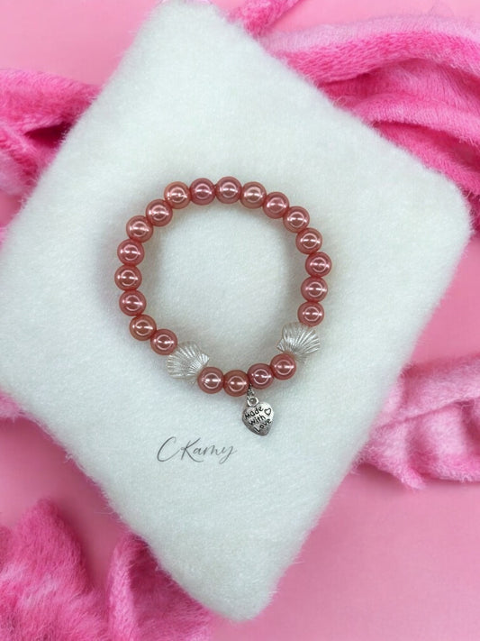 Bracelet femme coquillage nacré coeur rose saumon brillant