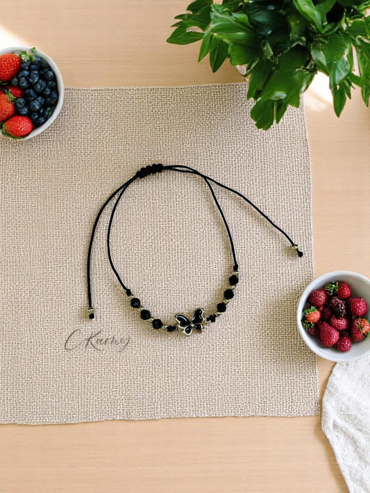 Bracelet femme cordon papillon couleur facettes noir