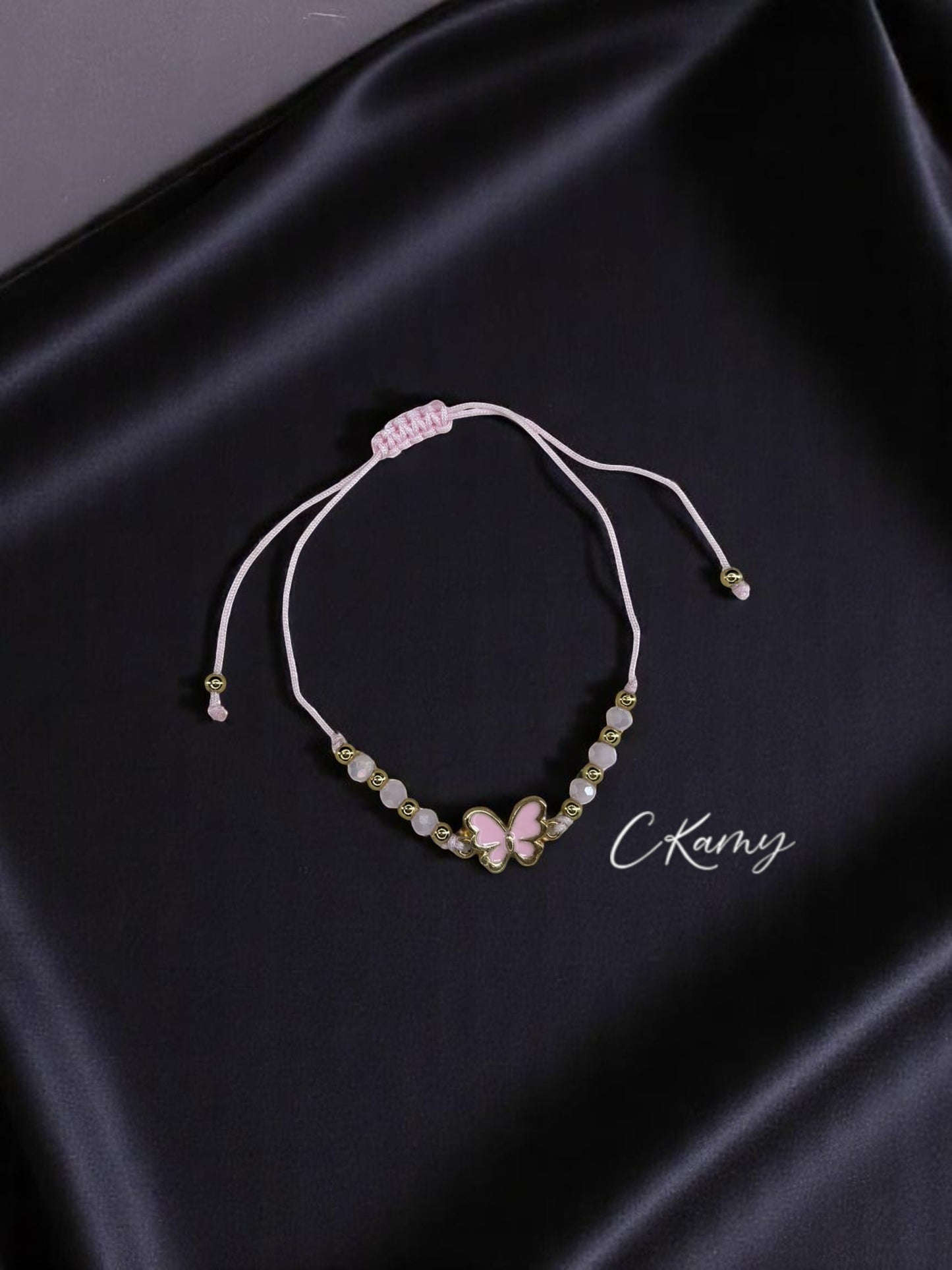 Bracelet femme cordon papillon couleur facettes rose clair