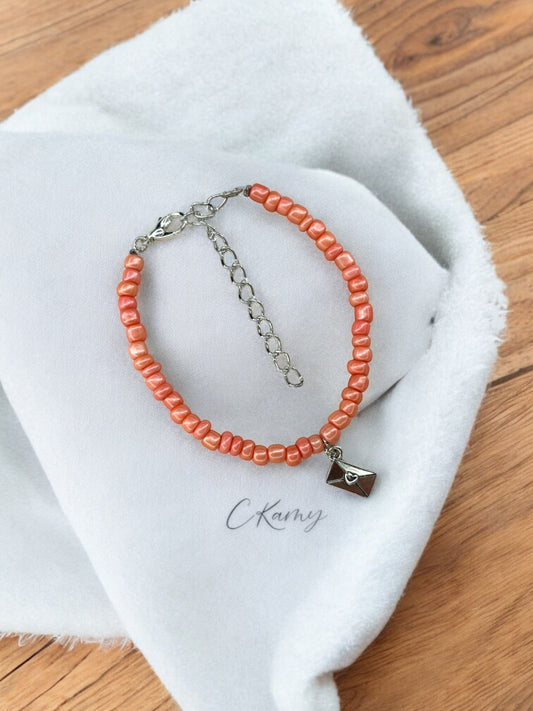 Bracelet femme courrier rocaille rose corail