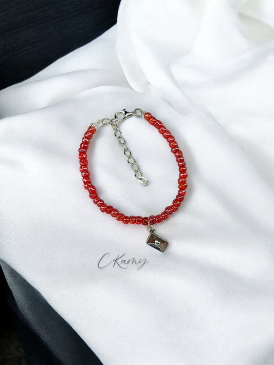 Bracelet femme courrier rocaille rouge transparent